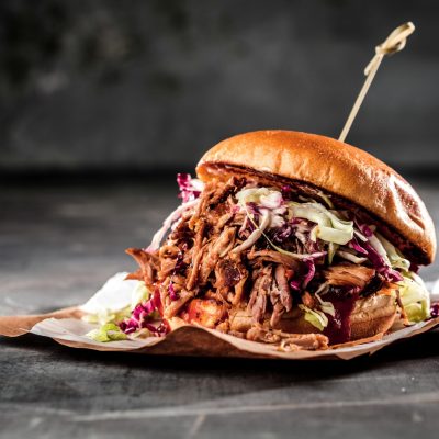 homemade pulled pork burger with bbq sauce close up